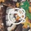 Jachetă Astro Coach pentru copii cu logo Arch Logo și imprimeu camuflaj arbori Jachetă Astro Coach pentru copii cu logo Arch Logo și imprimeu camuflaj arbori