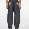 Pantaloni de tâmplar din denim cu Running Dog alergând pe marginea țesăturii