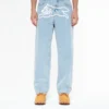 Pantaloni din denim cu două buzunare și câine alergând