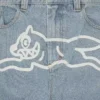 Pantaloni din denim cu două buzunare și câine alergând